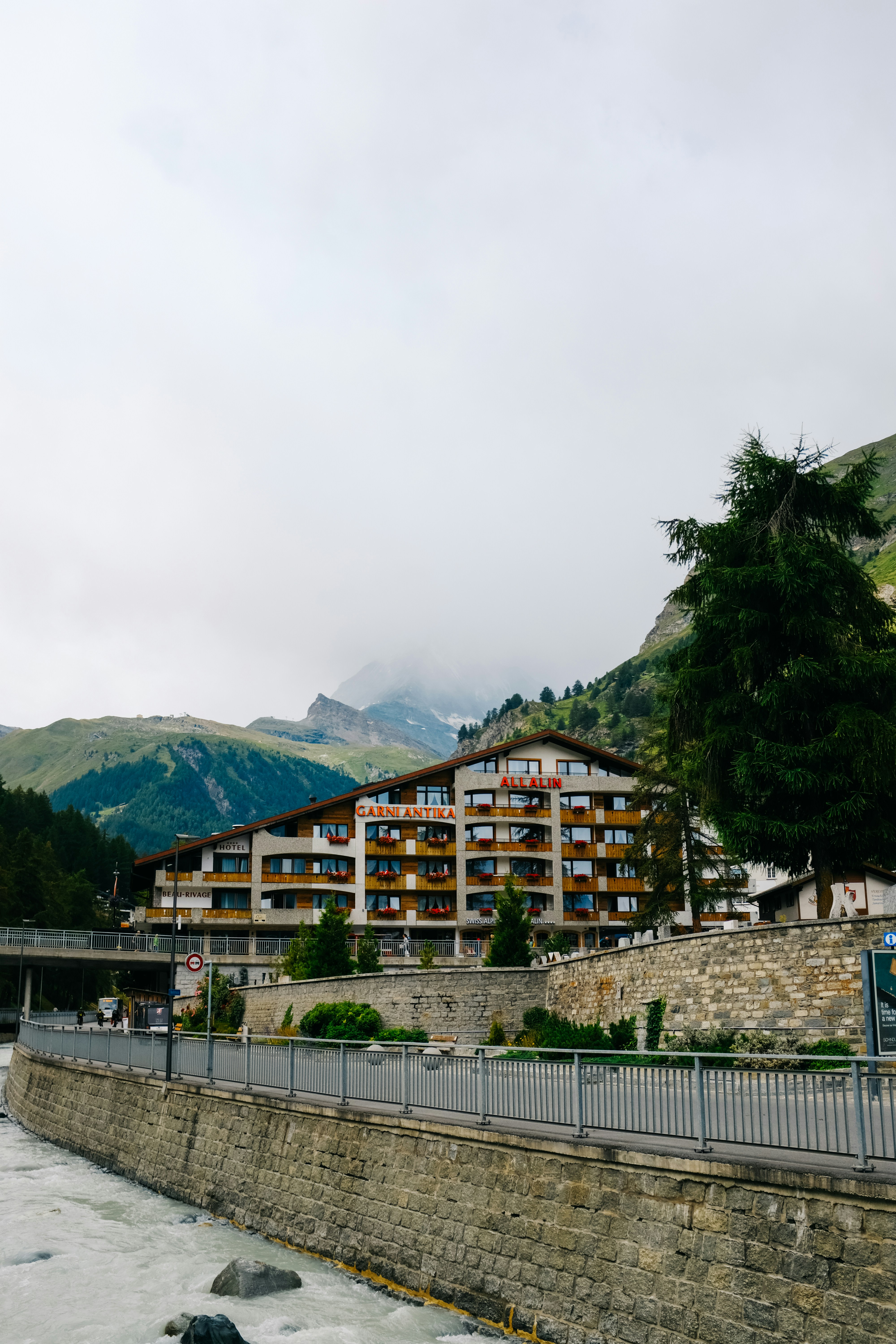 a large building sitting on the side of a river